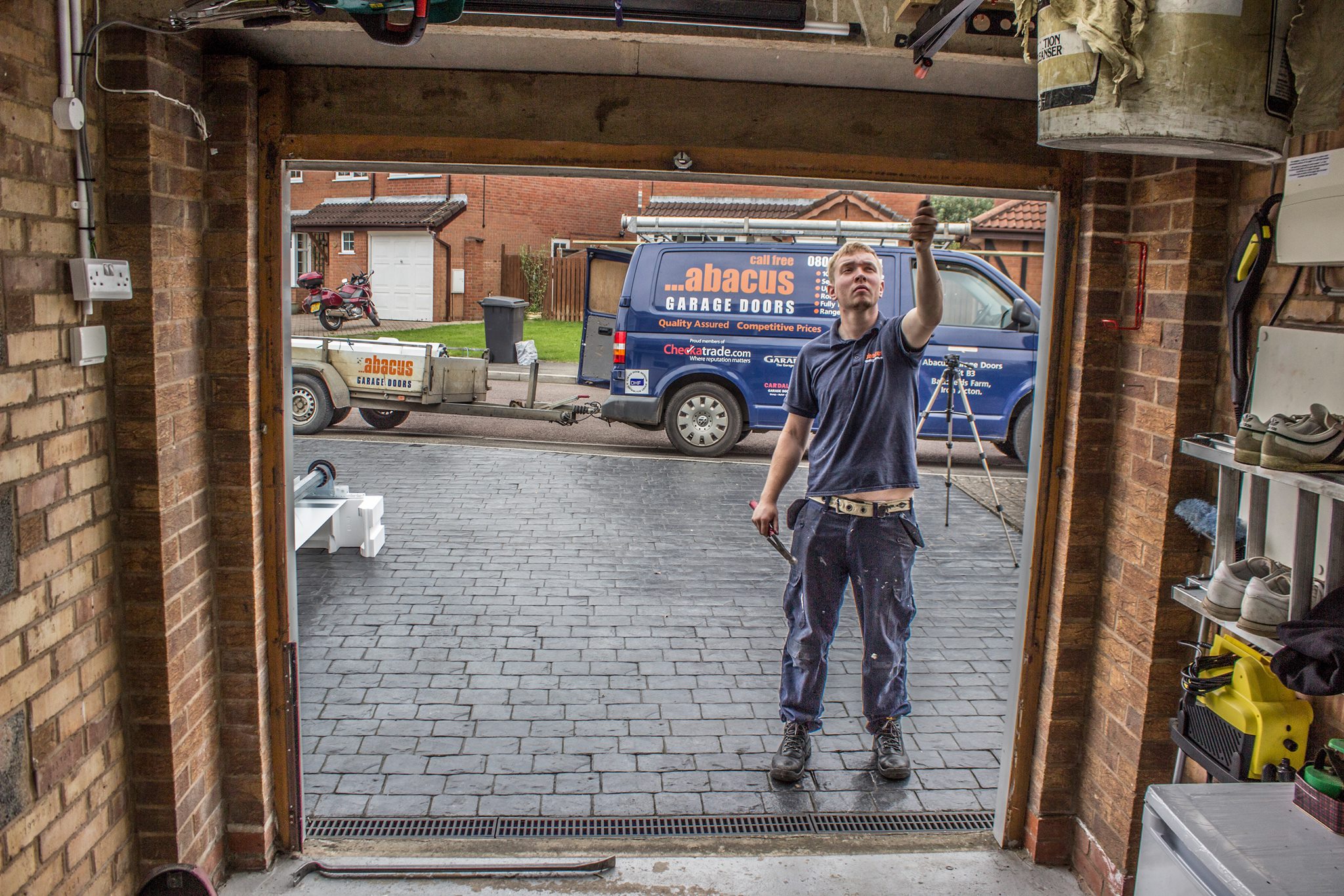 Man Checking Garage Door Installation